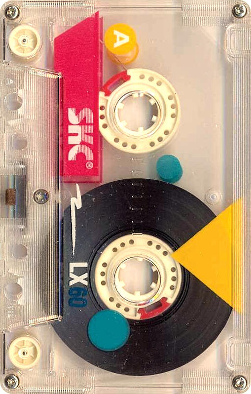 An old cassette tape with a clear casing printed with geometric shapes in red, blue, and yellow.
